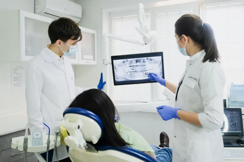 Dental team reviewing an X-ray with a patient
