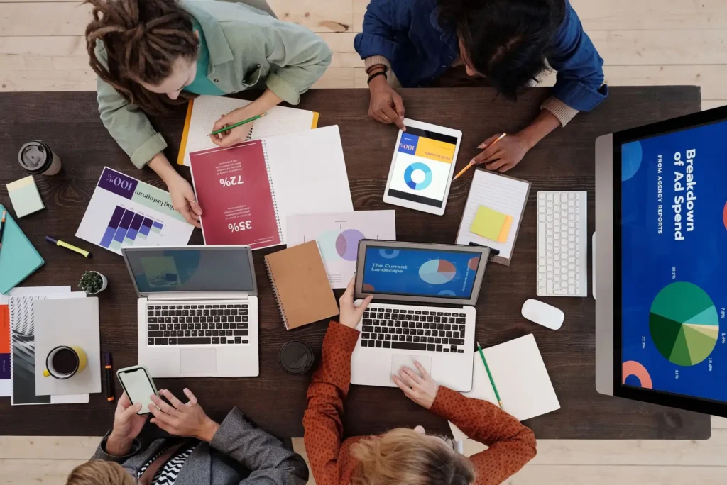 Overhead view of a team working through marketing reports