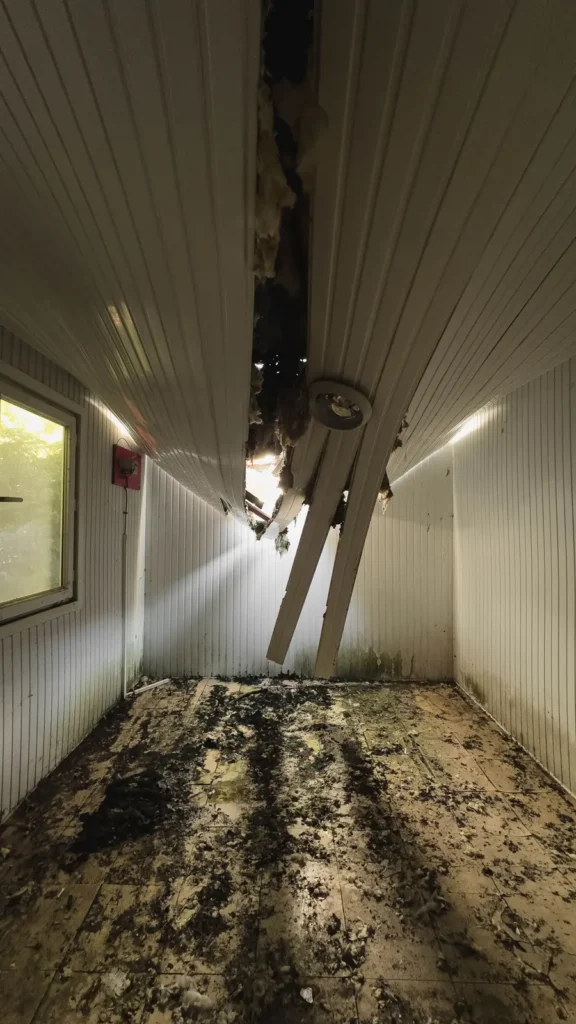 Room with a collapsed ceiling after water damage